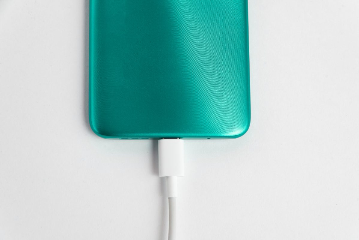 blue cell phone connected usb cable type c charging